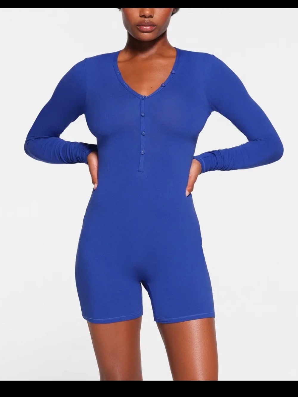 Skims cotton jersey Henley onesie in a vibrant cobalt blue color.